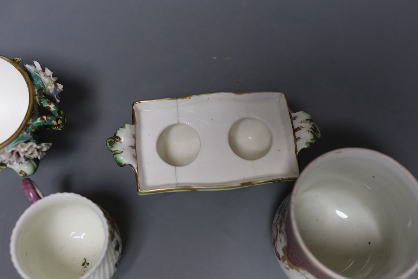 An 18th century Mennecy porcelain cup and cover, a Meissen style cup and cover, an English porcelain floral encrusted double inkwell and cover and a similar jar and cover